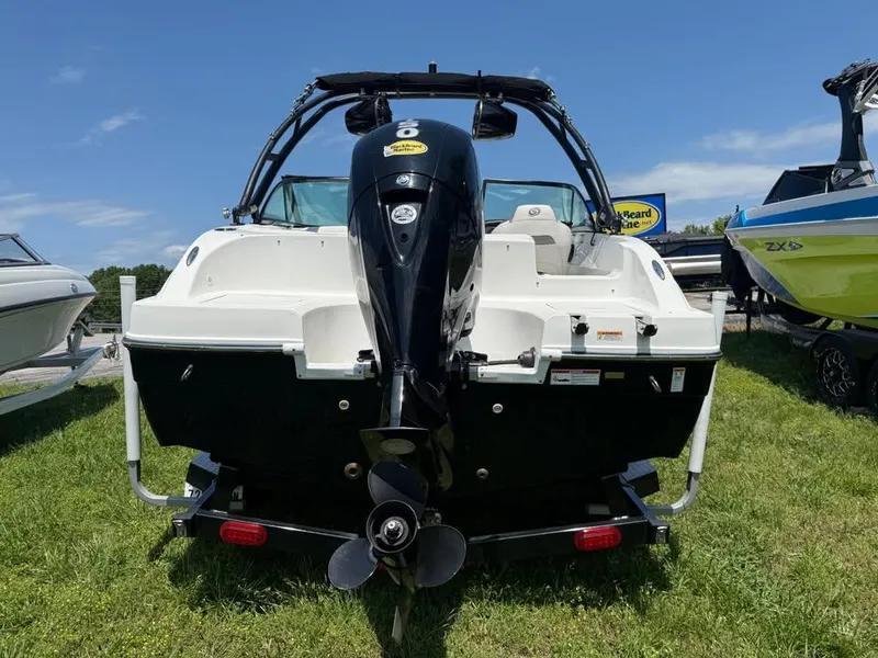 Slide: The Image of 2023 Hurricane SD 187 boat, rear view, displayed outdoors on grass. - 3