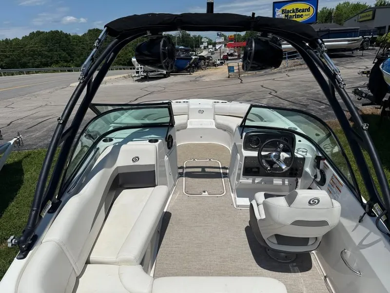 Slide: The Image of 2023 Hurricane SD 187 boat interior with seating and steering wheel, parked at Blackbeard Marine. - 4