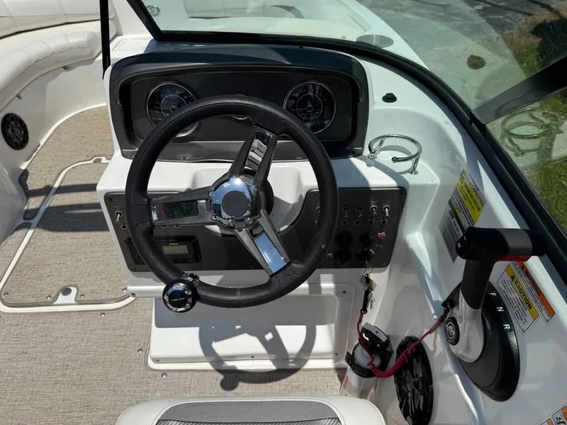 Slide: The Image of 2023 Hurricane SD 187 boat dashboard with steering wheel and control panel. - 5
