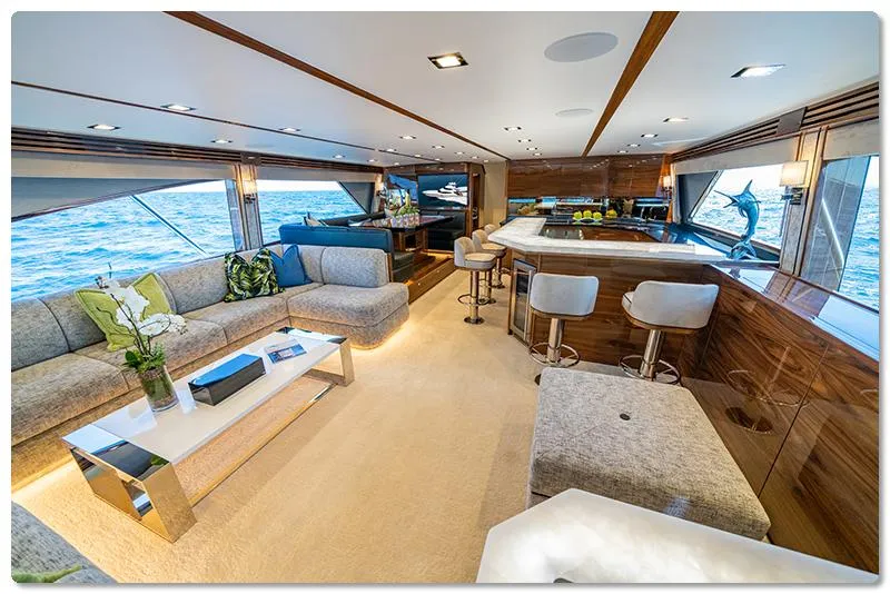 Slide: The Image of Luxurious interior of 2026 Viking 90 Skybridge yacht with elegant seating and ocean views. - 2