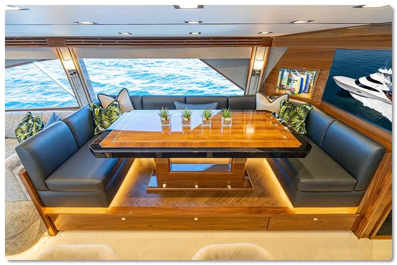 Slide: The Image of Luxurious interior of 2026 Viking 90 Skybridge yacht with elegant dining area and ocean view. - 5