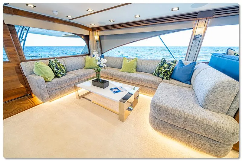 Slide: The Image of Luxurious interior of 2026 Viking 90 Skybridge yacht with ocean view and elegant seating. - 6