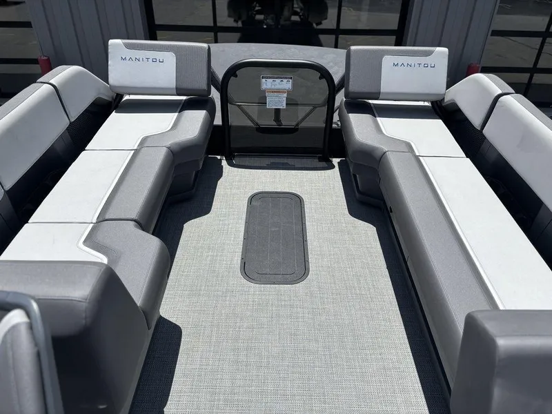 Slide: The Image of 2025 Manitou Cruise 22 Max Switchback interior with spacious seating and modern design. - 26