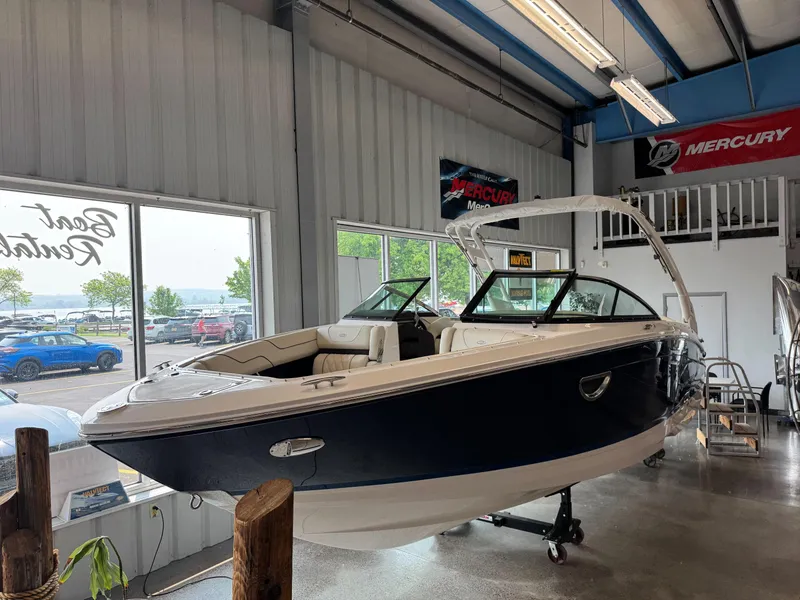 The Image of 2025 Regal LS6 boat displayed indoors, featuring sleek design and modern amenities. - 0