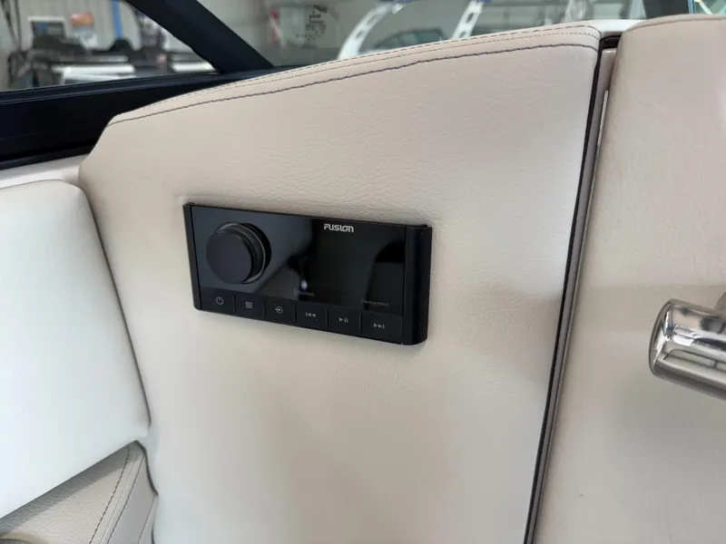 Slide: The Image of 2025 Regal LS6 interior with Fusion audio control panel on beige upholstery. - 13