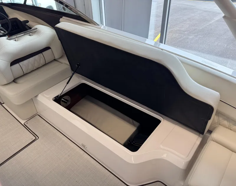 Slide: The Image of 2025 Regal LS6 boat interior with open storage compartment. - 18