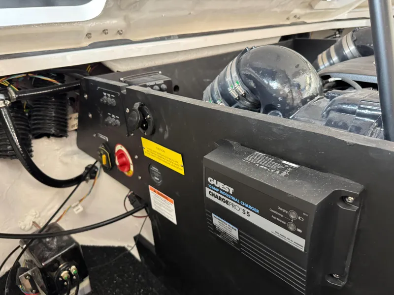 Slide: The Image of Engine compartment of 2025 Regal LS6 with battery charger and control panel. - 19