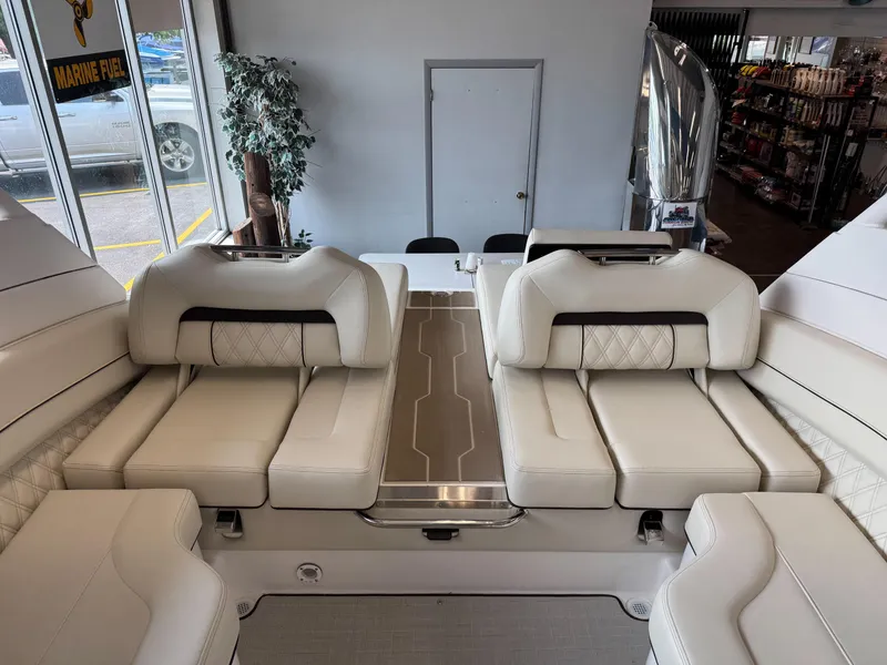 Slide: The Image of Luxurious interior of 2025 Regal LS6 boat with plush white seating. - 21