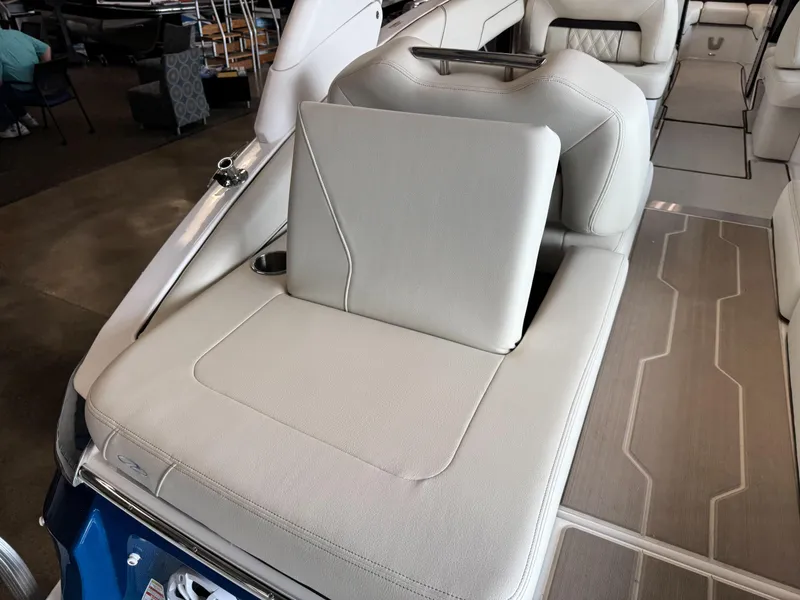 Slide: The Image of 2025 Regal LS6 boat interior with luxurious beige seating and modern design. - 24