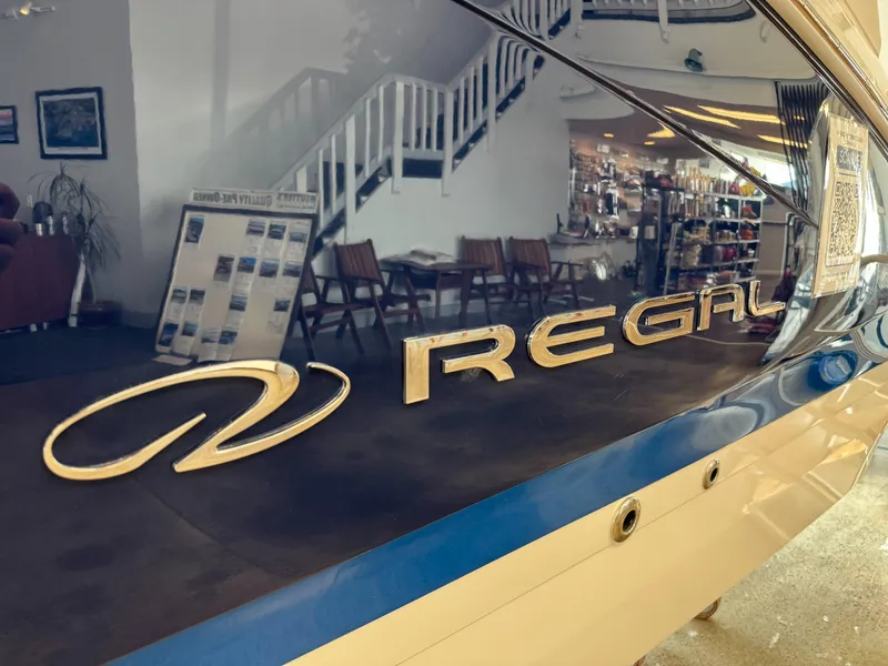 Slide: The Image of 2025 Regal LS6 boat with logo in showroom setting. - 26