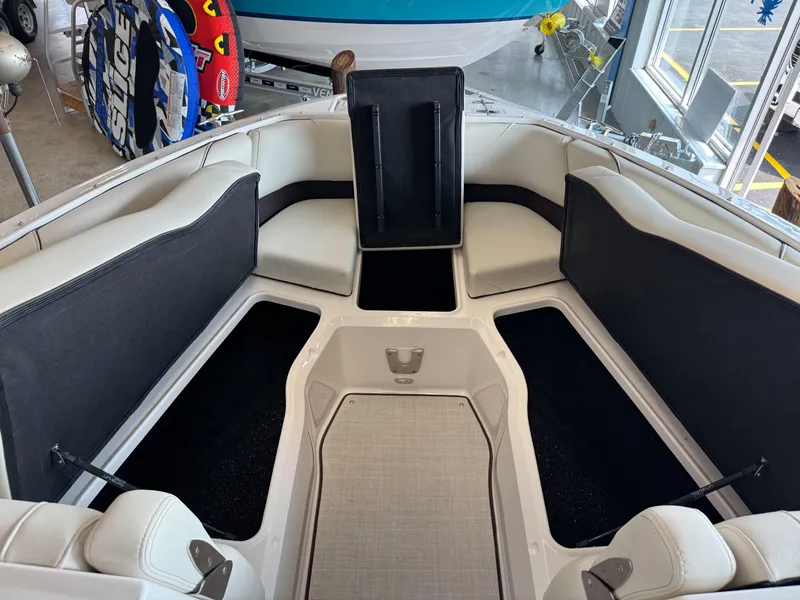 Slide: The Image of Interior of 2025 Regal LS6 boat with spacious seating and storage compartments. - 5
