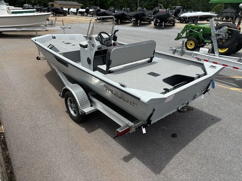 Slide: The Image of 2025 SeaArk Shadow 18 Center Console boat on trailer in outdoor lot. - 10