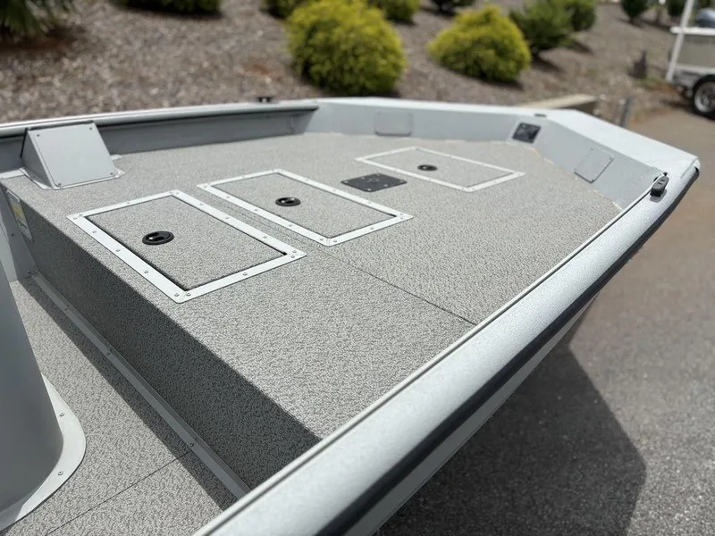 Slide: The Image of 2025 SeaArk Shadow 18 Center Console boat deck with storage compartments. - 4