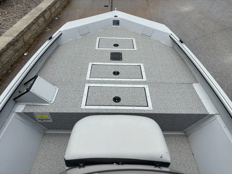 Slide: The Image of 2025 SeaArk Shadow 18 Center Console boat interior with storage compartments. - 5