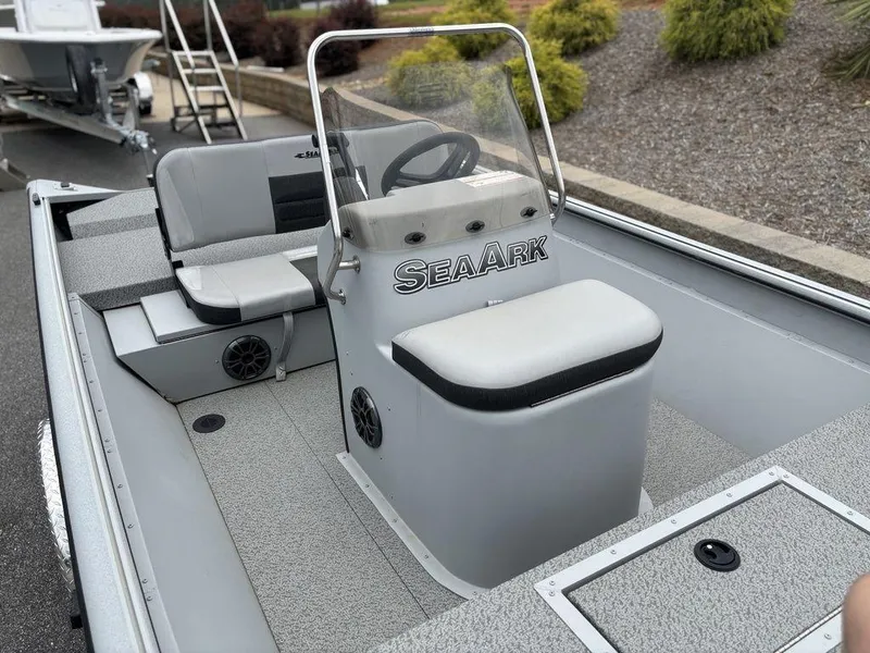 Slide: The Image of 2025 SeaArk Shadow 18 Center Console boat with seating and steering console. - 8