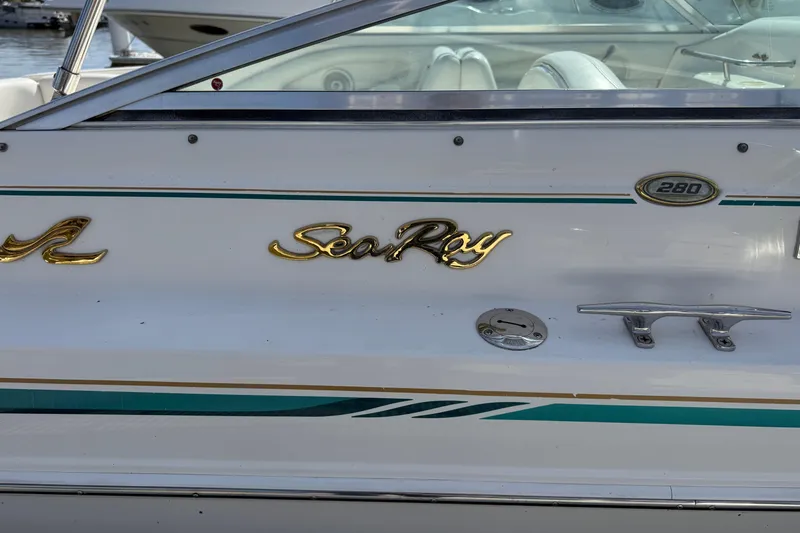 Slide: The Image of 1998 Sea Ray 280 Sun Sport boat, side view with logo. - 14
