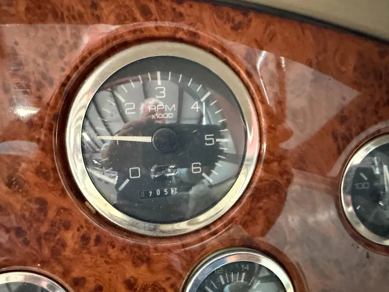 Slide: The Image of Tachometer on 1998 Sea Ray 280 Sun Sport boat dashboard, wood grain panel. - 3