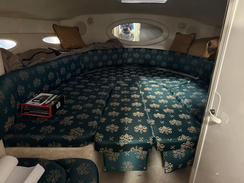 Slide: The Image of 1998 Sea Ray 280 Sun Sport cabin with patterned seating and cushions. - 5