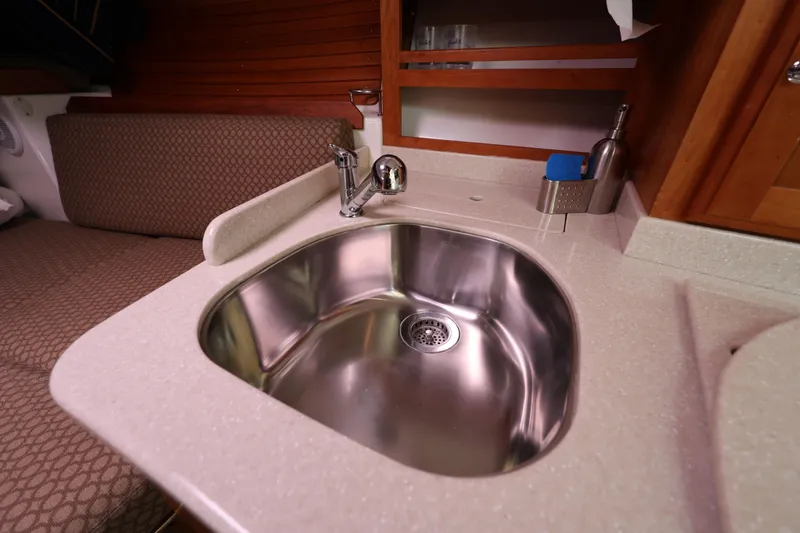 Slide: The Image of 2011 Back Cove 30 yacht interior with stainless steel sink and countertop. - 28