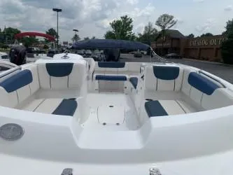 Slide: The Image of 2023 Tahoe 2150 Deck Boat with spacious seating and modern design. - 4