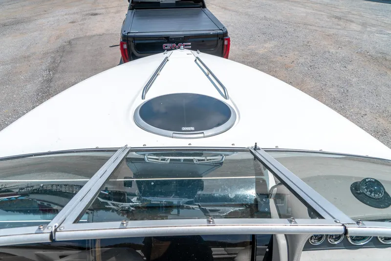 Slide: The Image of 2001 Cobalt 227 Cuddy boat hitched to a GMC truck, viewed from above. - 18