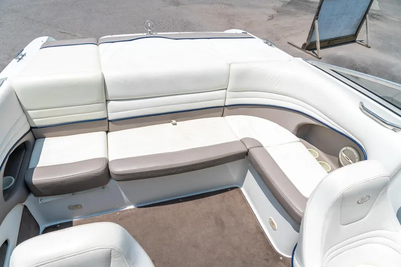 Slide: The Image of 2001 Cobalt 227 Cuddy boat interior with white and gray seating. - 21