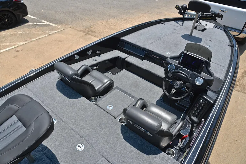 Slide: The Image of 2022 Phoenix 920 Elite boat interior with dual seats and steering console. - 22