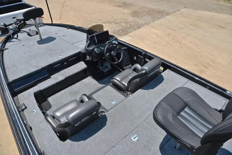 Slide: The Image of 2022 Phoenix 920 Elite boat interior with seating and steering console. - 23