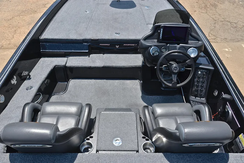 Slide: The Image of 2022 Phoenix 920 Elite boat interior with dual seats, steering console, and modern dashboard. - 24