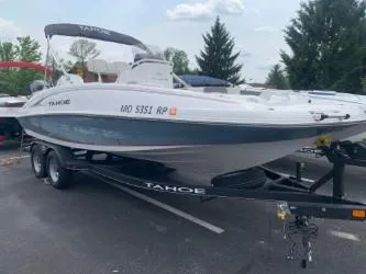 The Image of 2023 Tahoe 2150 Deck Boat CC on trailer, parked outdoors. - 0