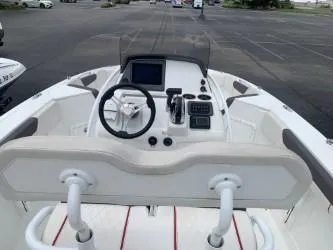 Slide: The Image of 2023 Tahoe 2150 Deck Boat CC cockpit with steering wheel and control panel. - 3