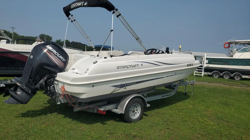 Slide: The Image of 2016 Starcraft Limited 1915 OB boat on trailer with Mercury outboard motor. - 2