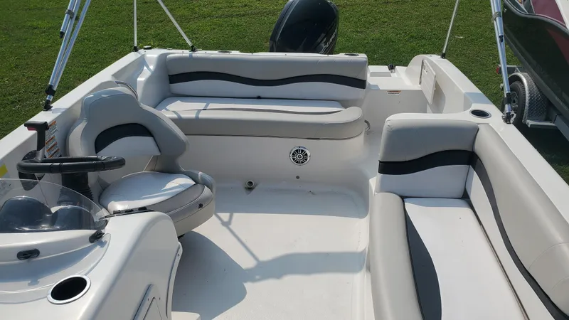Slide: The Image of 2016 Starcraft Limited 1915 OB boat interior with seating and steering wheel. - 3