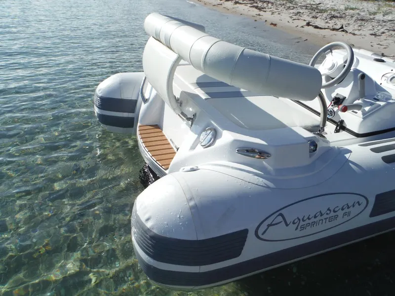 Slide: The Image of Aquascan Sprinter F11 inflatable boat near sandy shore, 2015 model. - 7