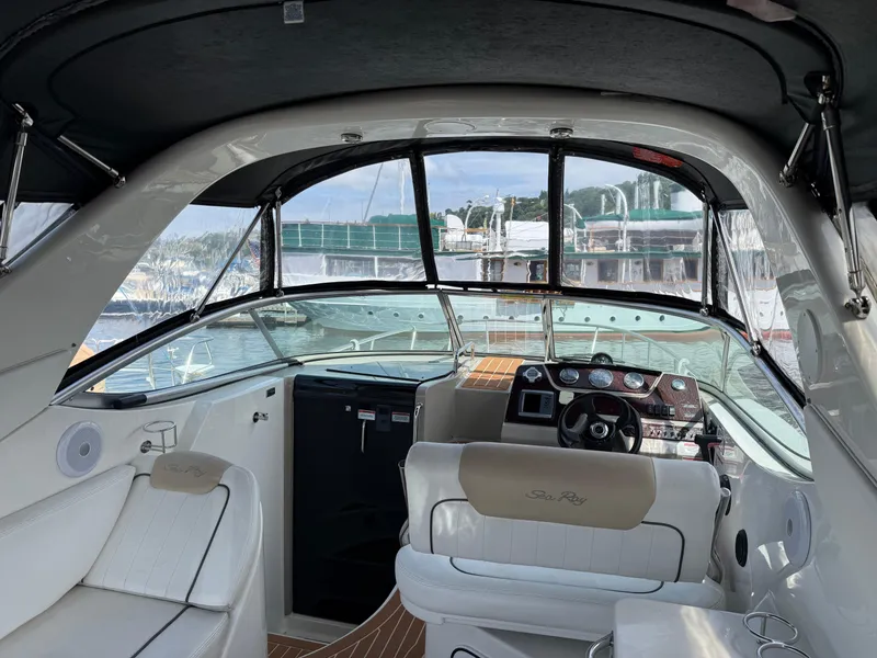 Slide: The Image of Interior view of 2009 Sea Ray 270 Sundancer boat with helm and seating. - 2