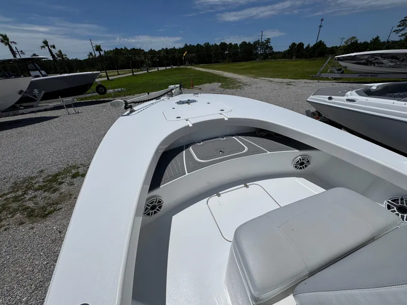 Slide: The Image of 2021 ZCB 26 Freemason boat, white deck, outdoor display, clear sky, grassy background. - 14