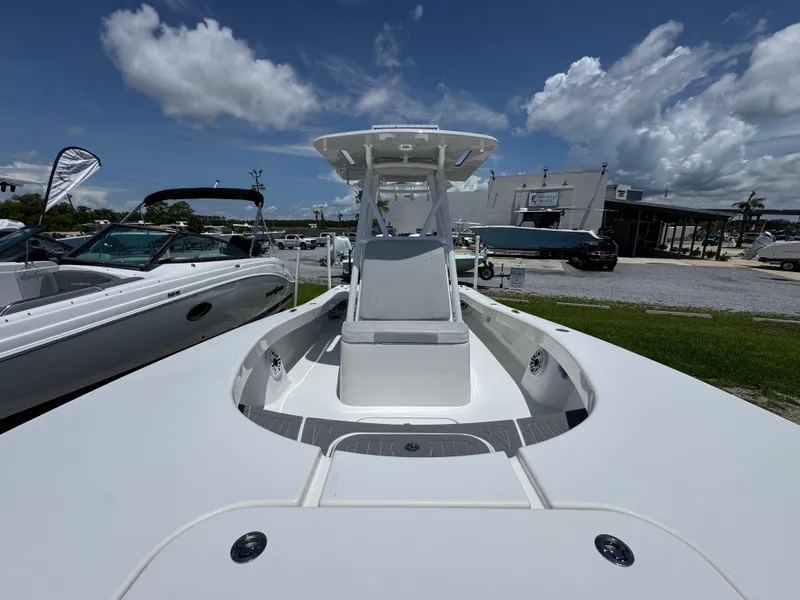 Slide: The Image of ZCB 26 Freemason 2021 boat, sleek design, white deck, outdoor display, clear sky background. - 20