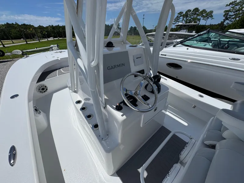 Slide: The Image of Center console of a 2021 ZCB 26 Freemason boat with Garmin navigation. - 25