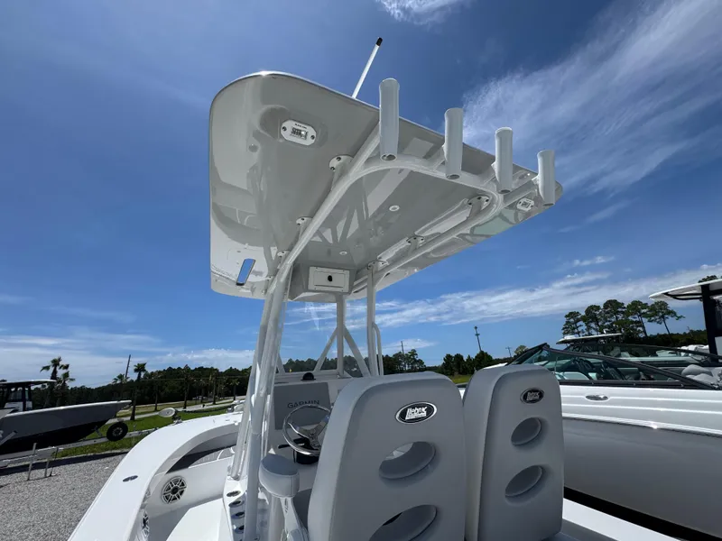 Slide: The Image of 2021 ZCB 26 Freemason boat with T-top under clear blue sky. - 29