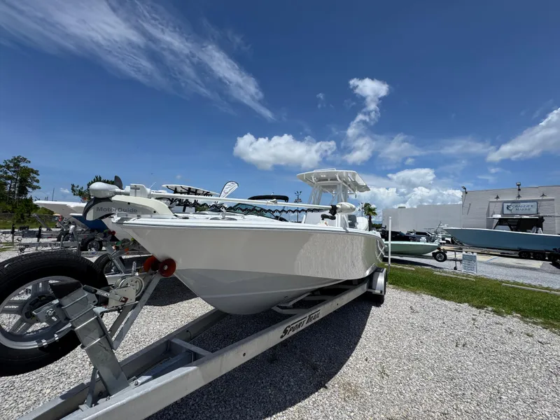 Slide: The Image of 2021 ZCB 26 Freemason boat on trailer under clear blue sky. - 4