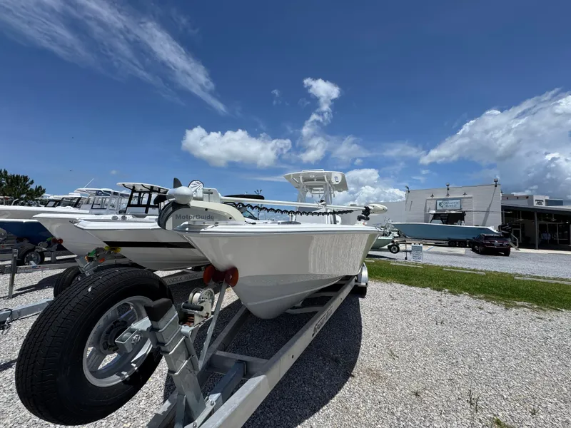 Slide: The Image of 2021 ZCB 26 Freemason boat on trailer under blue sky. - 5