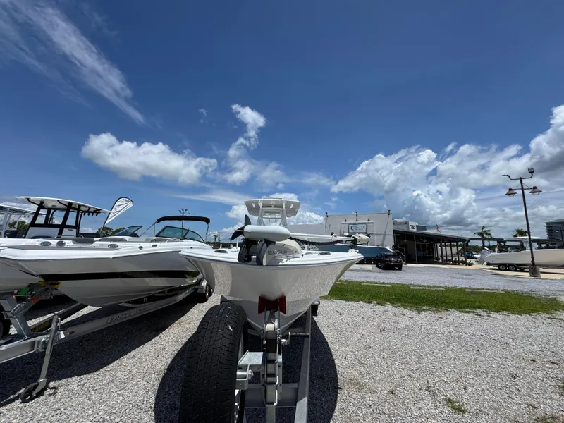 Slide: The Image of 2021 ZCB 26 Freemason boat on trailer under clear blue sky. - 6