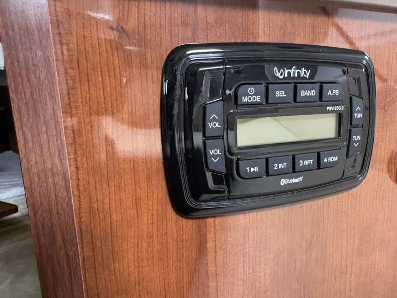Slide: The Image of Infinity stereo system on 2016 Four Winns 255 Vista boat dashboard. - 4