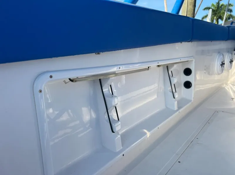 Slide: The Image of 2011 Spectre 360 Roadster interior detail with blue accents and storage compartment. - 13