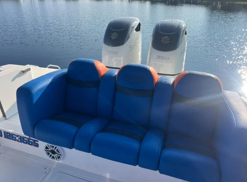 Slide: The Image of Blue seating on 2011 Spectre 360 Roadster boat with twin 350 engines. - 17