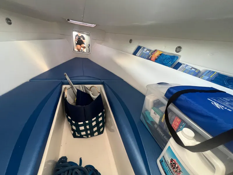 Slide: The Image of Interior of a 2011 Spectre 360 Roadster boat with storage and seating. - 33