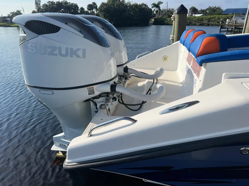 Slide: The Image of Spectre 360 Roadster 2011 with Suzuki outboard engines, docked on a sunny day. - 43