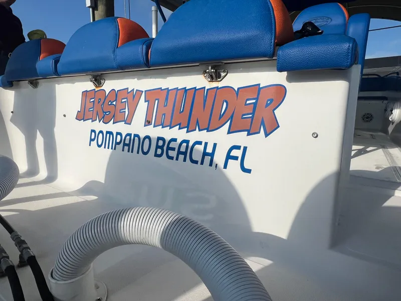 Slide: The Image of Spectre 360 Roadster 2011 boat with "Jersey Thunder" text, Pompano Beach, FL. - 44
