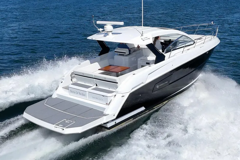 Slide: The Image of 2021 Cruisers Yachts 390 Express Coupe cruising on open water. - 11