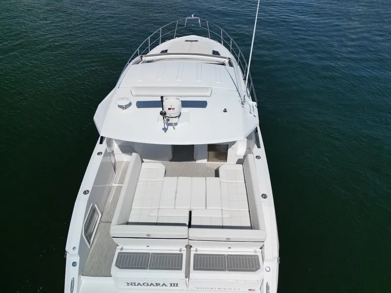 Slide: The Image of 2021 Cruisers Yachts 390 Express Coupe on water, aerial view. - 38
